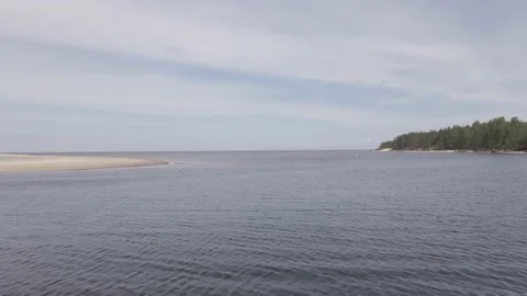 Drone flying over a river delta near sea, birds flying around Stock Footage 161153640