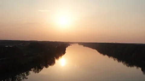 Drone flying over the river at evening sunset time. Beautiful nature wild life Stock Footage 127570444