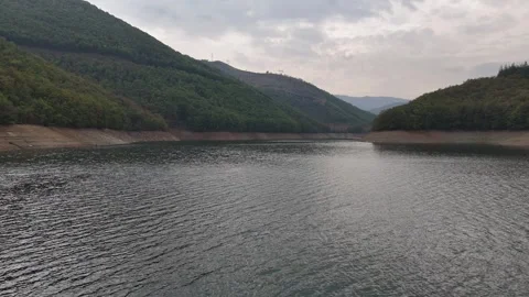 Drone flying over the river inside valley of mountain Stock Footage 292490034