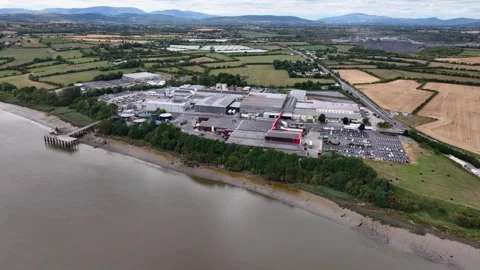 Drone flying over the River Suir revealing meat processing plant at Grannagh Stock Footage 345039111