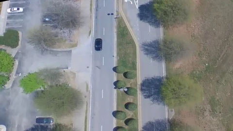 Drone flying over Road passing car Stock Footage 129062844
