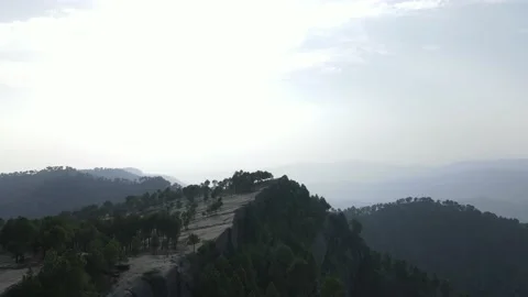Drone flying over rocks and trees, 4K Stock Footage 159504315