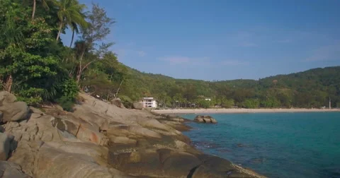 Drone Flying Over Rocks on Tropical Beach in Phuket Thailand Stock Footage 63087665