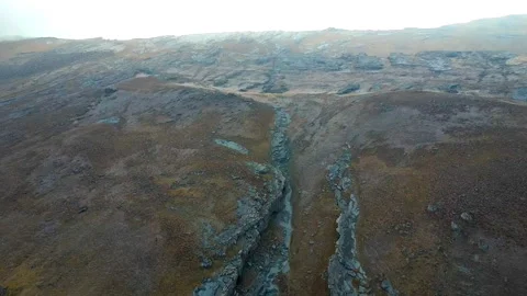 Drone flying over rocky dry mountains. Aerial view of the Hojja Gur Gur Ota or Stock Footage 292541885