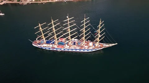 Drone flying over sailing ship moored in Kotor, Montenegro Stock Footage 320747782