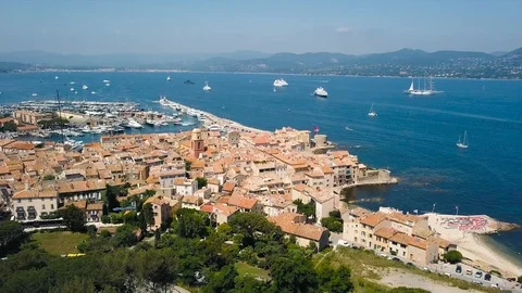 Drone flying over Saint-Tropez during summer with marina in background Stock Footage 101650048