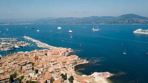 Drone flying over Saint-Tropez during summer with marina in background Stock Footage 101650051