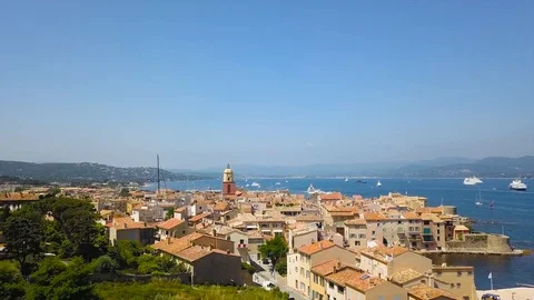 Drone flying over Saint-Tropez during summer with marina in background Stock Footage 101650068