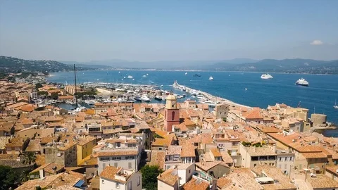 Drone flying over Saint-Tropez during summer with marina in background 스톡 동영상 101650079