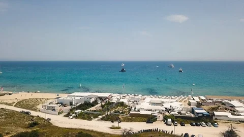 Drone flying over Saint-Tropez during summer with marina in background 스톡 동영상 101650137