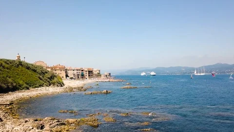 Drone flying over Saint-Tropez during summer with boats in background Stock Footage 101650230