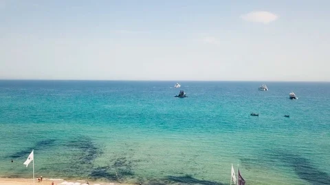 Drone flying over Saint-Tropez during summer with yachts in background 스톡 동영상 101650233