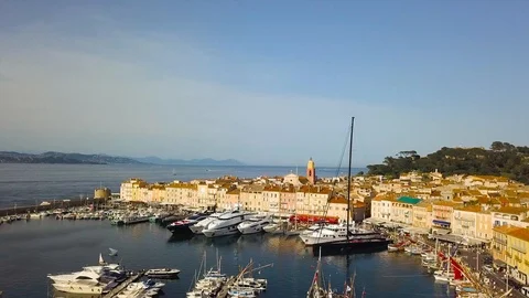 Drone flying over Saint-Tropez during summer with marina in background 스톡 동영상 101650386