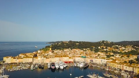 Drone flying over Saint-Tropez during summer with marina in background 스톡 동영상 101650400
