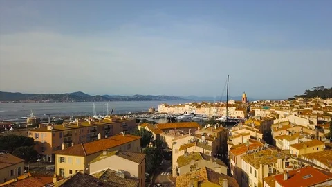 Drone flying over Saint-Tropez during summer with marina in background Stock Footage 101650538