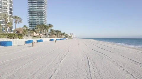 DRONE FLYING OVER SAND ON BEACH Stock Footage 104482660