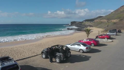 Drone Flying Over Sandy Beach Parking Lot In Honolulu, Hawaii Stock Footage 154172449