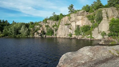 Drone Flying Over a Scenic Rocks of McCrae Lake. Ontario, Canada Stock Footage 248244016