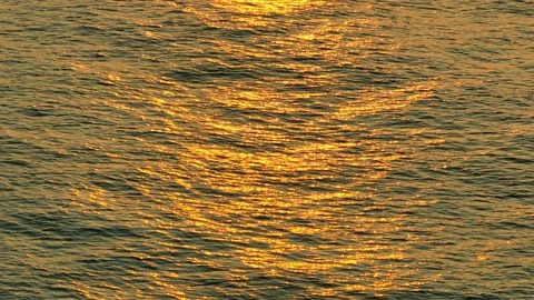Drone flying over the sea during sunrise Video stock 237733358