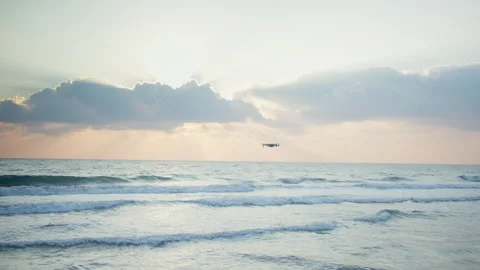 Drone flying over the sea during a beautiful sunset, sunset on the sea Stock Footage 297300907