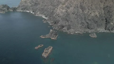 Drone Flying Over the Sea Toward Rocky Cliffs at Cape Komo, Ehime, Japan Stock Footage 302395079