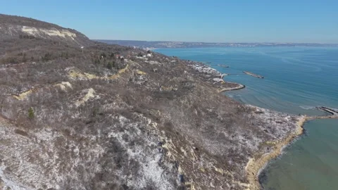 Drone flying over seaside cliffs and wide open ocean horizon Stock Footage 328282786