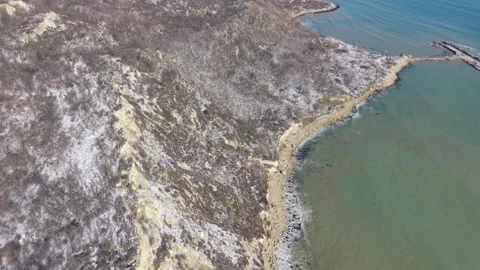 Drone flying over seaside cliffs and wide open ocean horizon Stock Footage 328282788