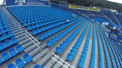 Drone flying over the seats of a soccer stadium Stock Footage 63961453