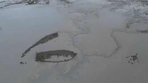 Drone Flying Over Ship Graveyard from River to Shore, Morbihan, France Stock Footage 302565597