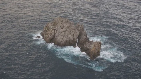 Drone flying over the small and rocky beautiful island, Mallorca during a sunset Stock Footage 101284351