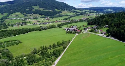 Drone is flying over the small cosy village in the Austria mountains during Stock Footage 82243132
