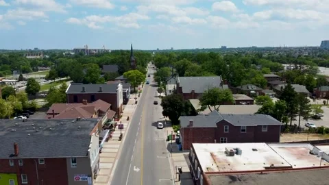 Drone flying over small downtown shops on a sunny day in Mississauga. Vídeos de archivo 236355013