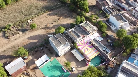 A drone flying over a small Indian village. Aerial view of Indian village h.. 스톡 동영상 244593162