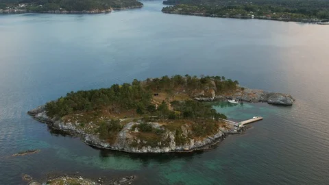 Drone flying over small private island in Norway, drone stock footage by Dron Stock Footage 127789673
