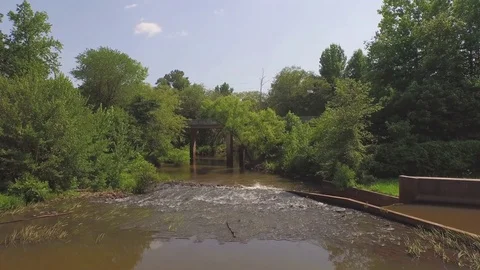 Drone Flying over small river and bridge during summer Stock Footage 85376782