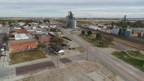 Drone Flying Over Small Rural Town Toward Grain Silos Near Train Tracks Stock Footage 229184608