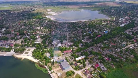 Drone flying over the small town near the river. Aerial view. Stock Footage 83511069