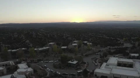 Drone flying over small western town at sunset Stock Footage 167673570