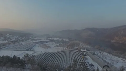 Drone flying over a snow covered public park  Stock Footage 84839507