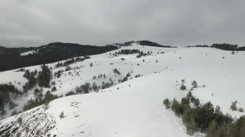 Drone flying over the snow covered hills. Stock Footage 217453115