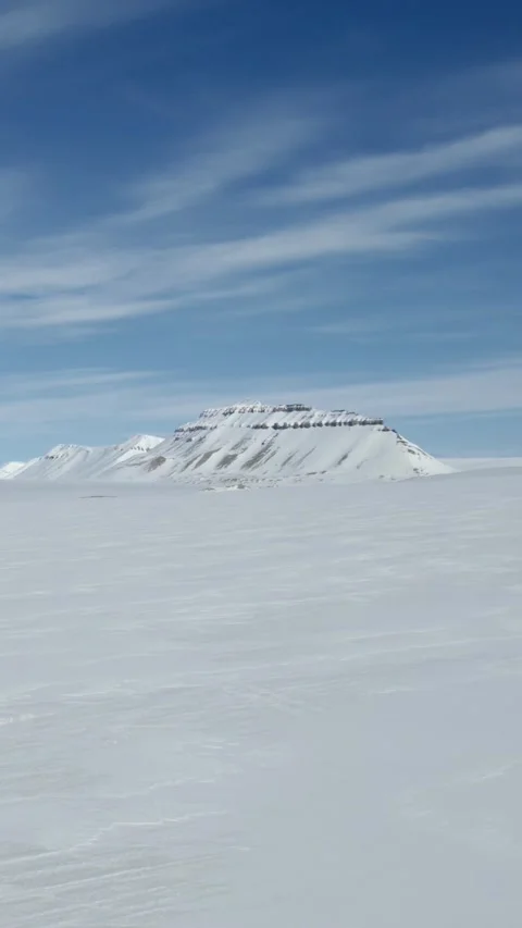 Drone Flying Over Snow Plain in Inland Svalbard, Vertical Stock Footage 340035926