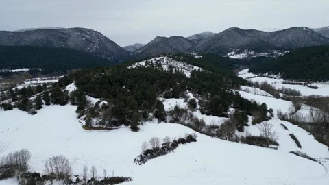 Drone flying over snowy forest and mountains, winter landscape 스톡 동영상 346560283