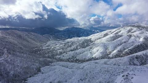 Drone flying up over a snowy mountain range Stock Footage 120636736