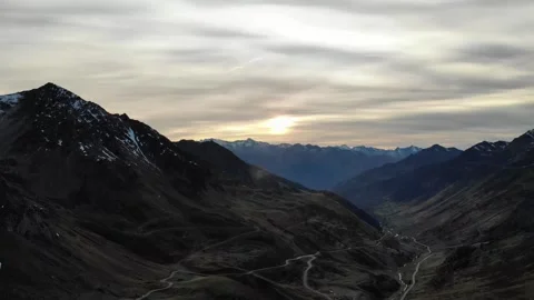 Drone flying over snowy mountains in France under cloudy skies Vidéo 331709738