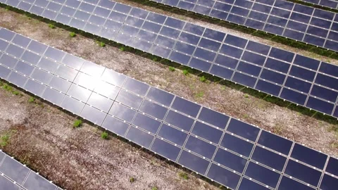 Drone flying over a solar panel farm for green energy Stock Footage 343831715