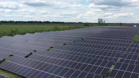 Drone is flying over the solar panels in the field, nature and eco energy, 4k Stock Footage 134003672