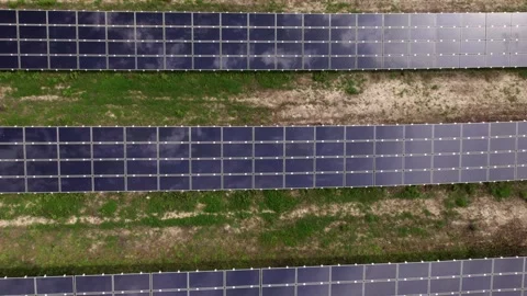 Drone flying over solar panels at a renewable energy farm Video stock 343831620