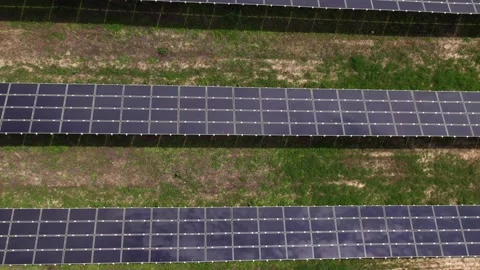 Drone flying over solar panels at a renewable energy farm Stock Footage 343831621