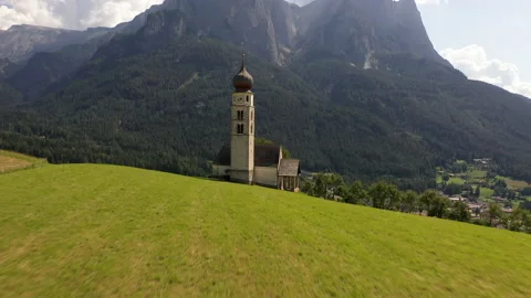 Drone flying over St Valentin Church in Dolomites Stock Footage 167060696