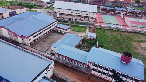 Drone flying over stadium wall and showing buildings near the Lekan Salami Vídeos de archivo 319011756